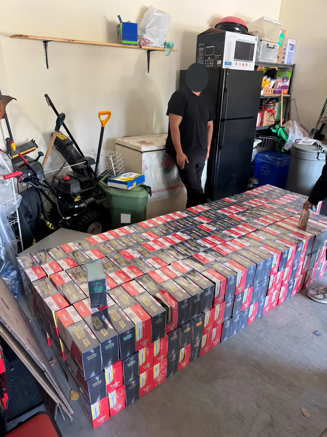 Sealed Pokémon products arranged in bulk, with faces concealed