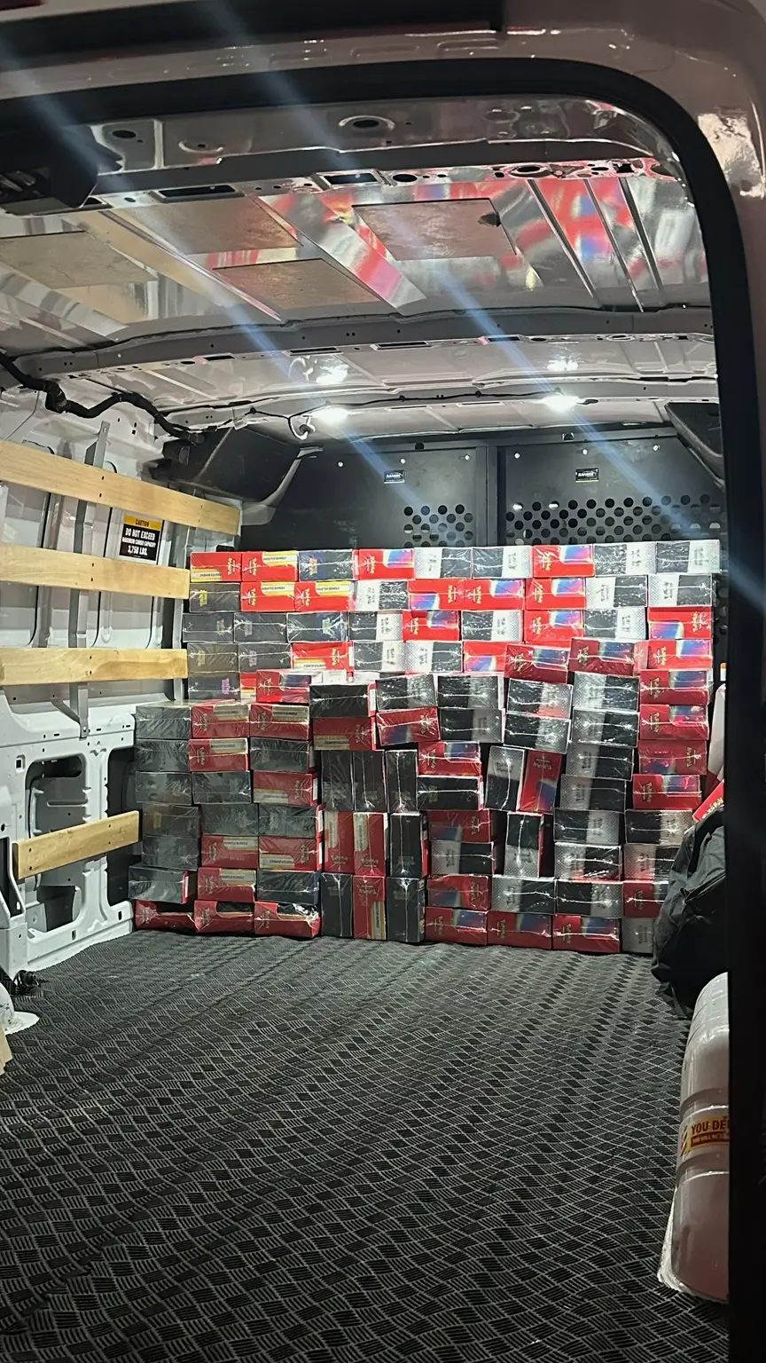Sealed Pokémon products stacked inside a cargo van